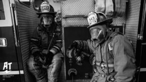 tech students in firefighting equipment with tech branding
