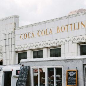 the exterior of the bottleworks building with original art deco typography