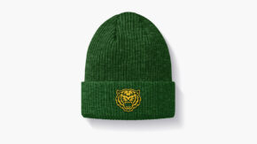 beanie with crispus attucks tiger badge on it