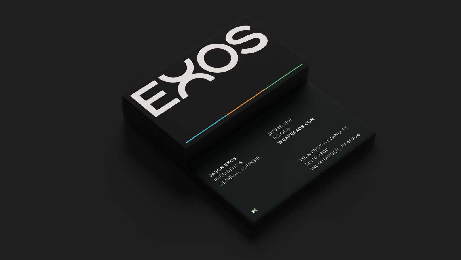 exos business card on a dark background